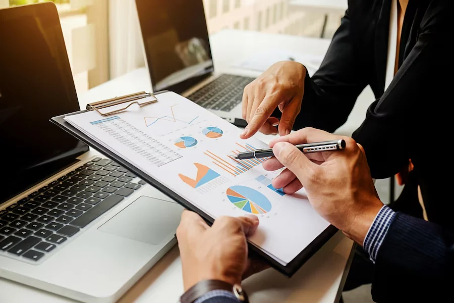 Consultants reviewing supply-chain performance data
